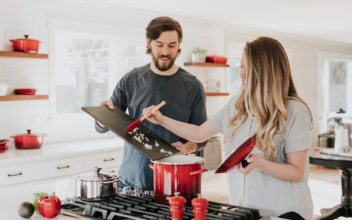 Happy couple in a bright, well-kept kitchen